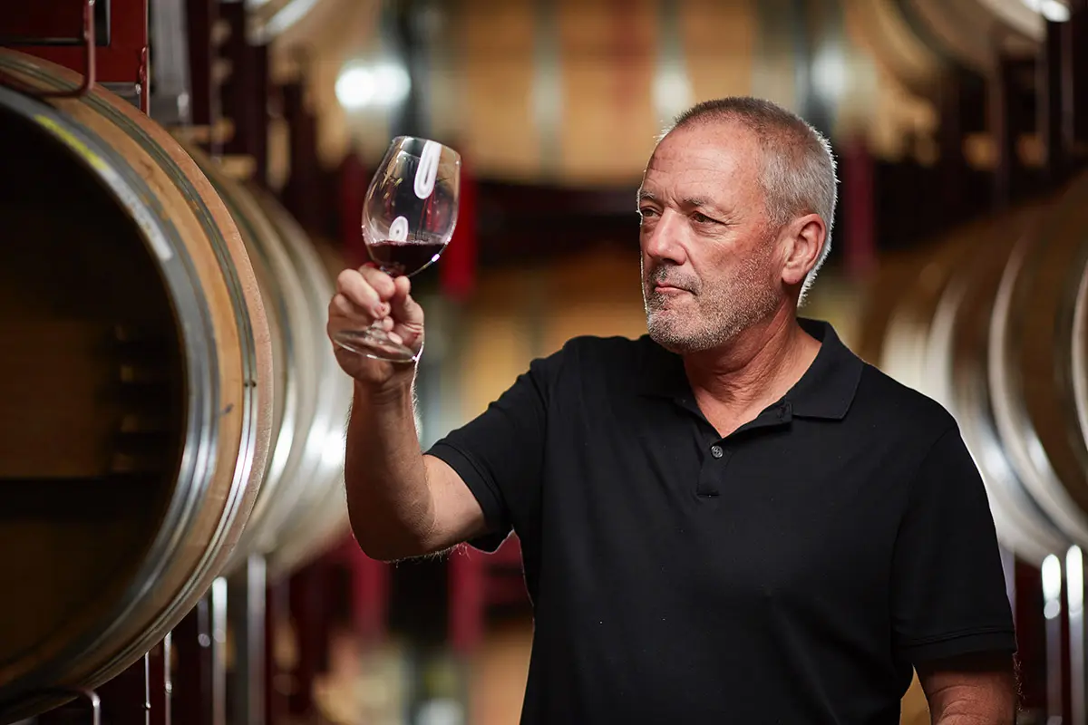 00 Hero Steven Kent Mirassou examines the color of his wine aging in barrel. (Courtesy of Steven Kent Mirassou) .jpeg