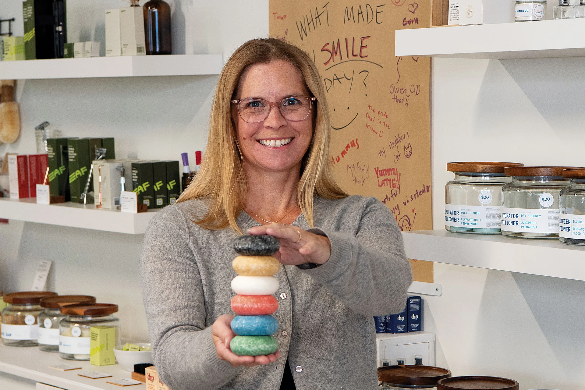 Meredith Keet, owner of Ethos, showing a stack of shampoo bars