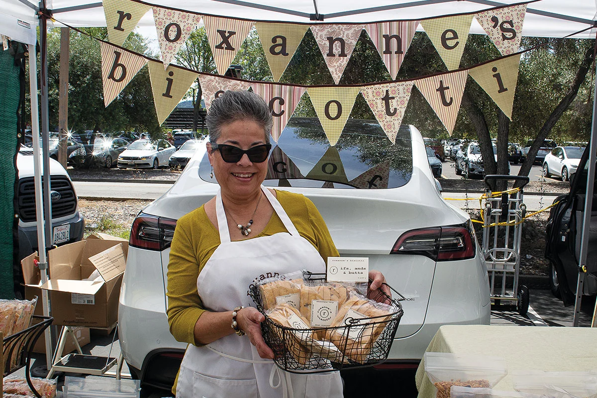 Roxanne Vinciguerra at the Saratoga Farmers Market with her Roxanne's Biscotti