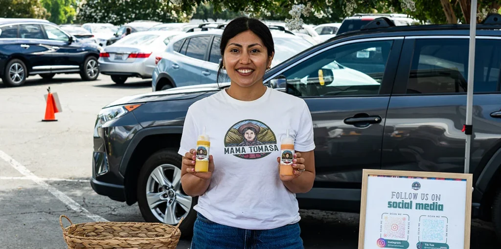 Mama Tomasa's Brigitte Hege with Aji Amarillo and Rocoto Red Chili sauces