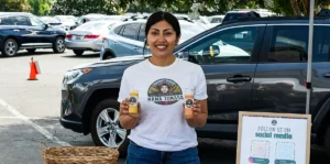 Mama Tomasa's Brigitte Hege with Aji Amarillo and Rocoto Red Chili sauces